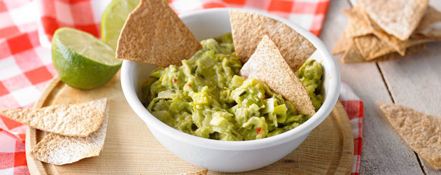 Homemade tortilla chips with leek guacamole