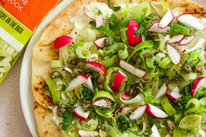 Flatbreads topped with leeks, ricotta cheese, fresh herbs and lemon